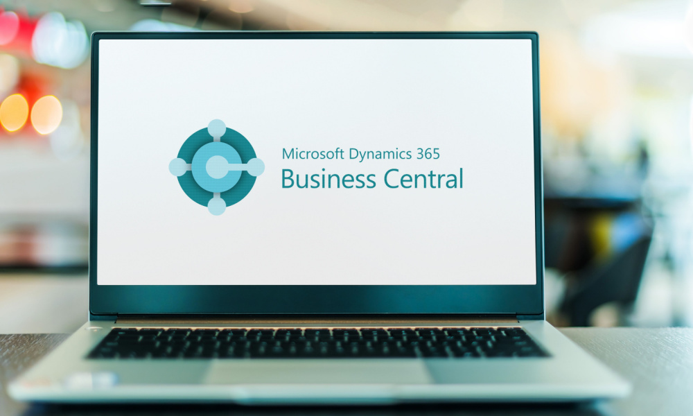 An open laptop showing a splash screen for Microsoft Dynamic 365 Business Central.